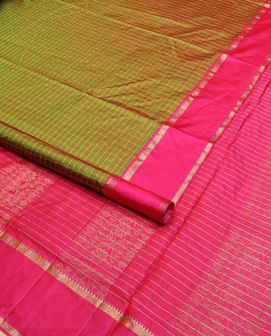 Green checked nine-yard silk saree, contrast rettai pettu border of rekku, and vanki designs, and traditional zari pallu