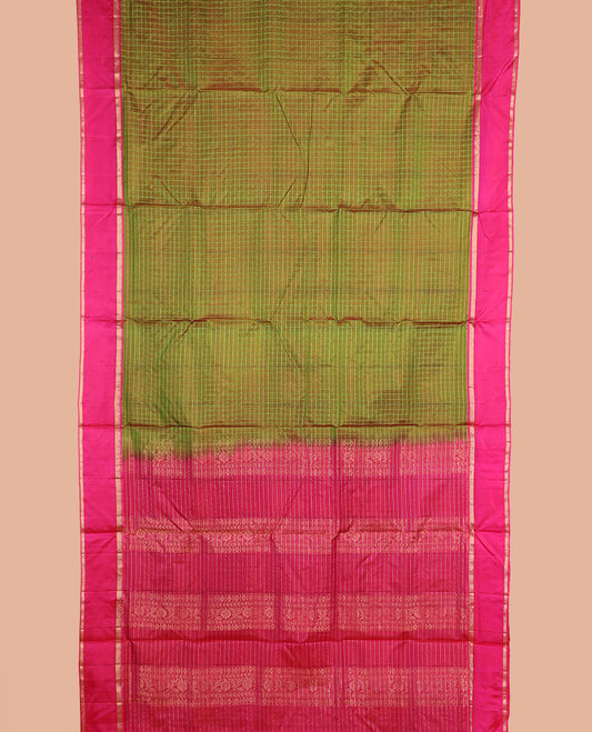 Green checked nine-yard silk saree, contrast rettai pettu border of rekku, and vanki designs, and traditional zari pallu