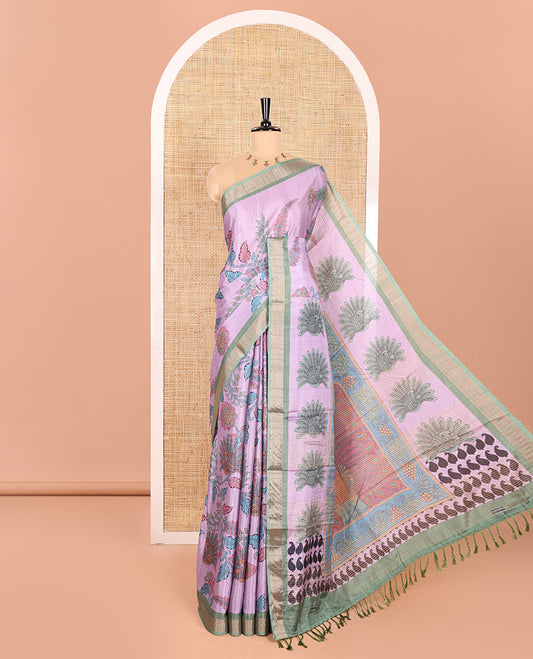Lavender Manipuri Silk Saree Accentuated with Kalamkari Floral and Peacock Prints All Over Its Body, Complemented by a Contrast Zari Border, Pallu Depicts a Big Peacock and Paisleys, and Paired with a Contrast Printed Blouse
