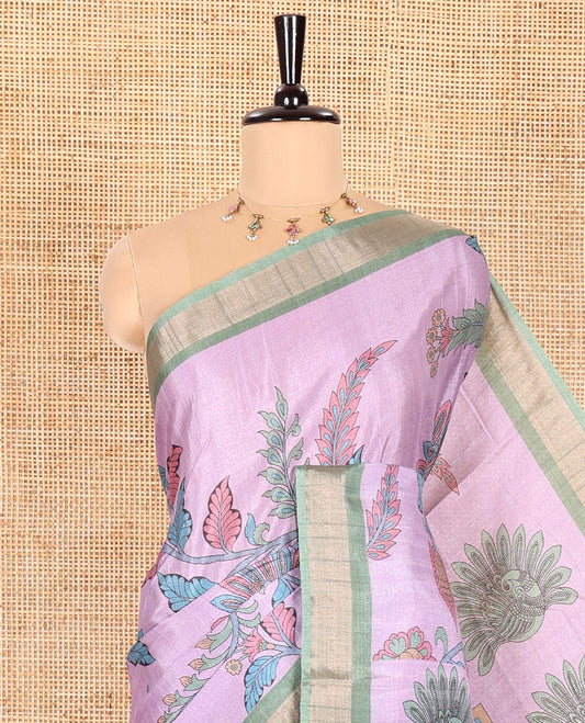 Lavender Manipuri Silk Saree Accentuated with Kalamkari Floral and Peacock Prints All Over Its Body, Complemented by a Contrast Zari Border, Pallu Depicts a Big Peacock and Paisleys, and Paired with a Contrast Printed Blouse