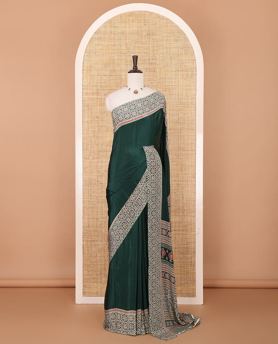 Bottle green plain modal satin saree, double-sided border & pallu intricately printed ajrakh-style design, ajrakh printed blouse