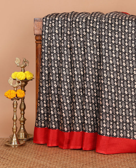Black batik-style geometric motifs block printed khadi cotton saree,contrast border, batik floral print pallu & plain red blouse