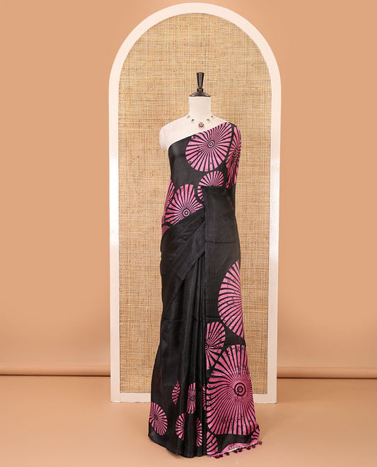 Black-base plain body khadi cotton saree with batik-style pink-color radiant sunburst design on its border & pallu, plain black blouse