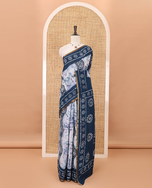 Blue batik-printed sungudi cotton saree, mango zari small border, batik-printed pallu & running blouse