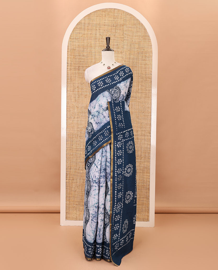 Blue batik-printed sungudi cotton saree, mango zari small border, batik-printed pallu & running blouse