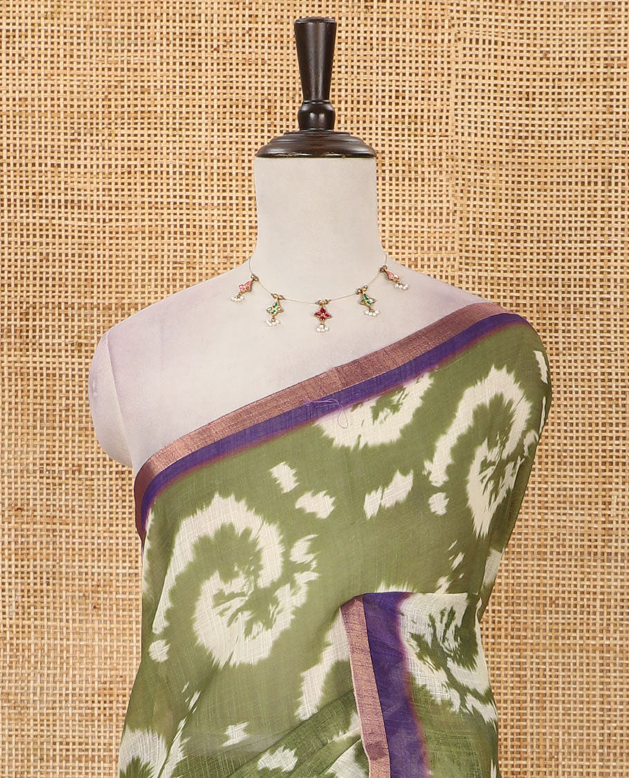 Olive green shibori-style printed linen cotton saree, contrast zari piping border, kamlamkari floral printed pallu & contrast printed blouse