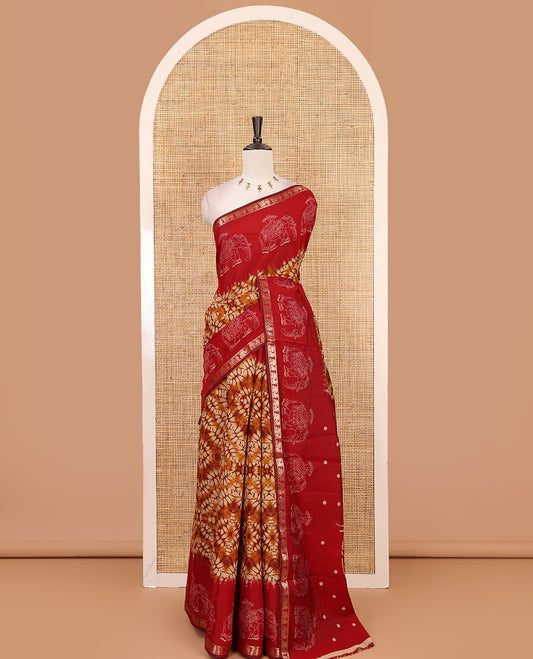 Mustard diamond patterns Shibori-style printed muslin cotton saree, contrast elephant motifs printed border, batik elephant motifs pallu & contrast flower buttas printed blouse