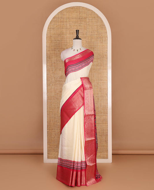 Cream-rani pink zari striped dola silk saree, contrast traditional zari border of leaf creeper, Ajrakh printed pallu, and Ajrakh printed blouse