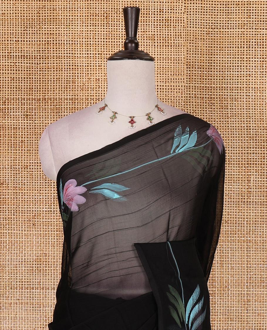 Borderless black floral motifs  hand brush painted semi-organza saree comes with tasseled pallu and without blouse