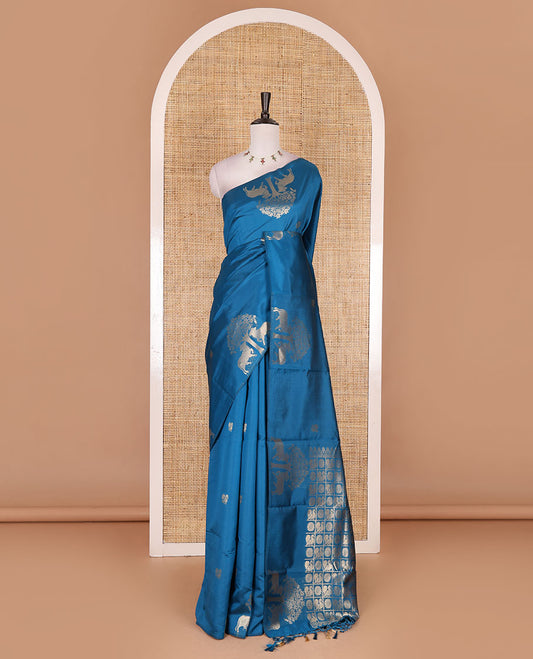 Borderless rama blue peacock, chakra, and pichwai cow buttas zari woven kanchi silk saree, peacock and chakra enclosed checked pallu, and matching blouse