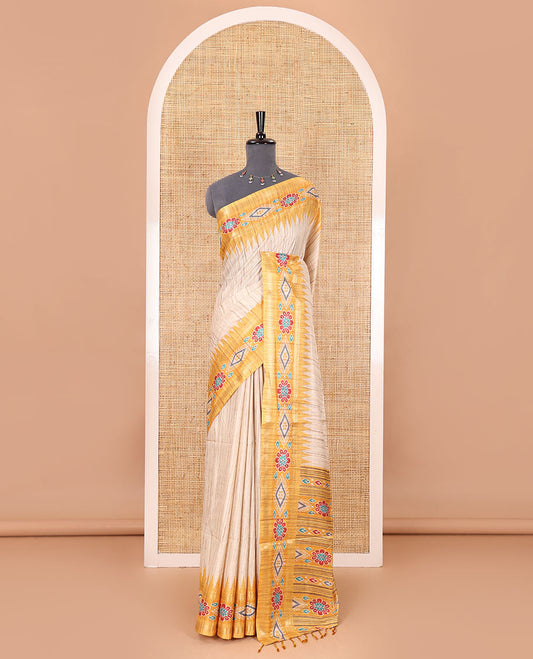 Chikku- yellow plain Katan silk saree, contrast ikkat floral-geometric printed temple border, ikkat printed pallu, and ikkat printed blouse
