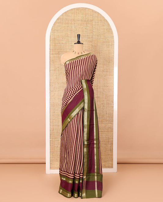 Wine vertically striped muslin silk saree, contrast zari rettai pettu border, kalamkari floral vine printed pallu, and a contrast plain blouse