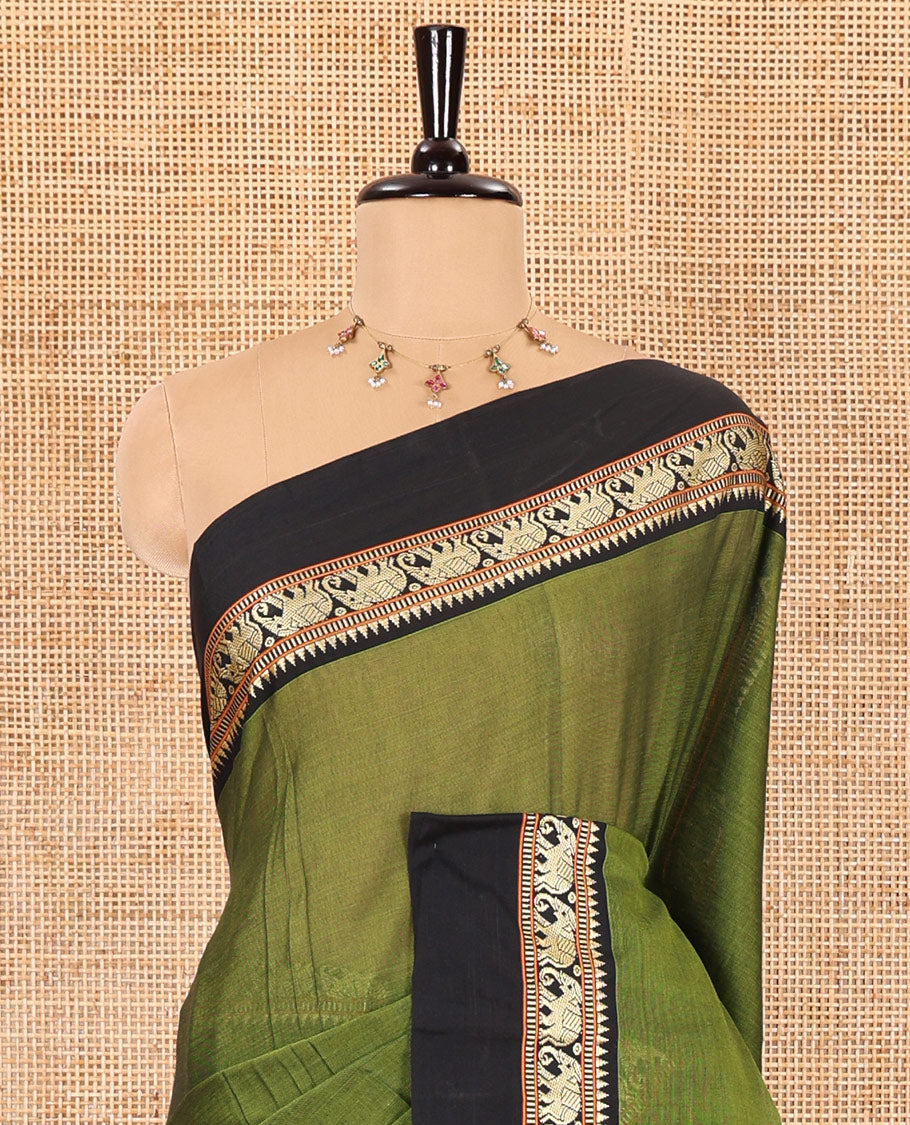 Olive plain mercerised cotton saree, contrast kal erangina thread border of elephant motifs, striped pallu, and a matching blouse