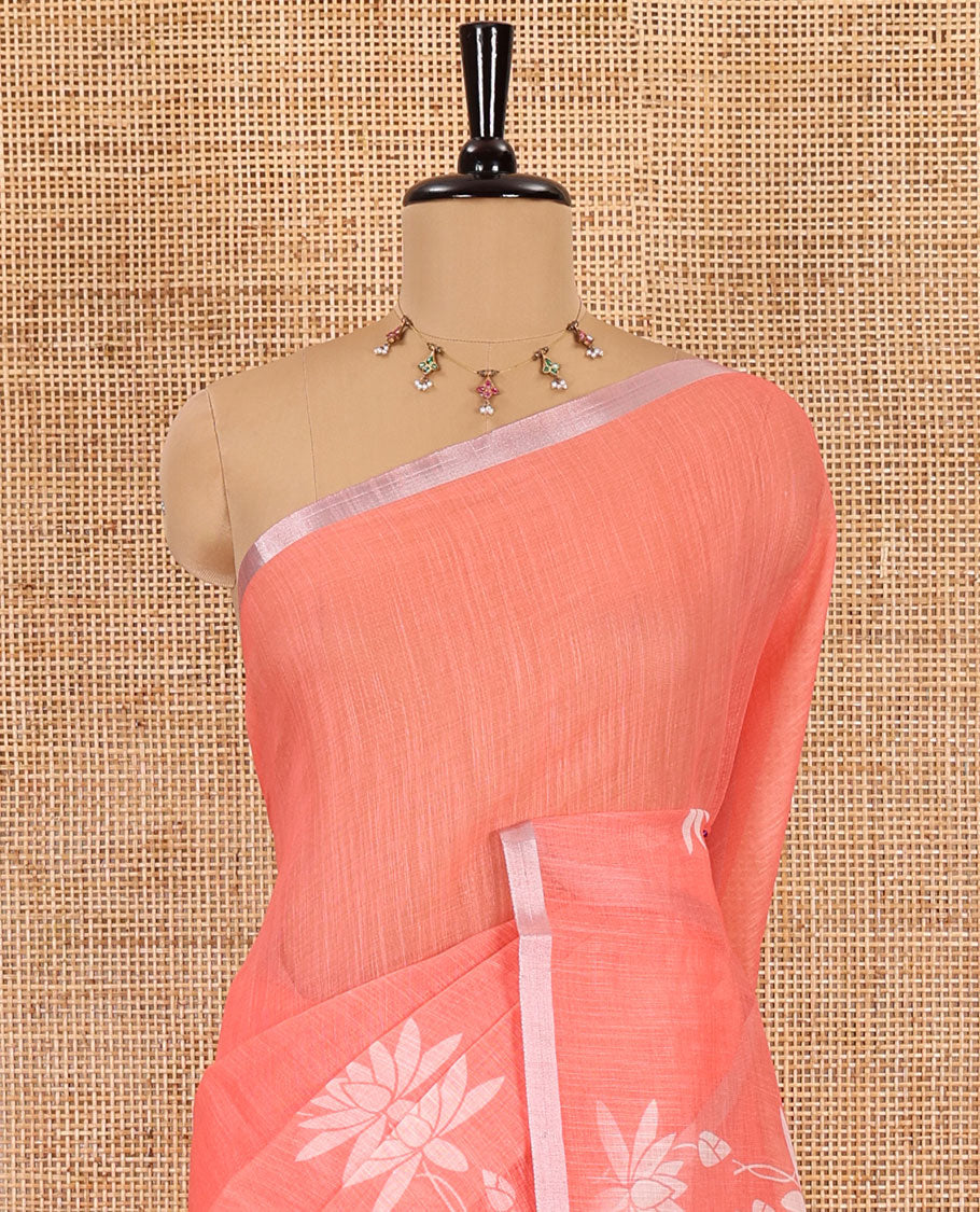 Orange Pichwai lotus printed linen cotton saree, piping zari border, colorful tasselled lotus printed pallu, and a contrast lotus printed blouse