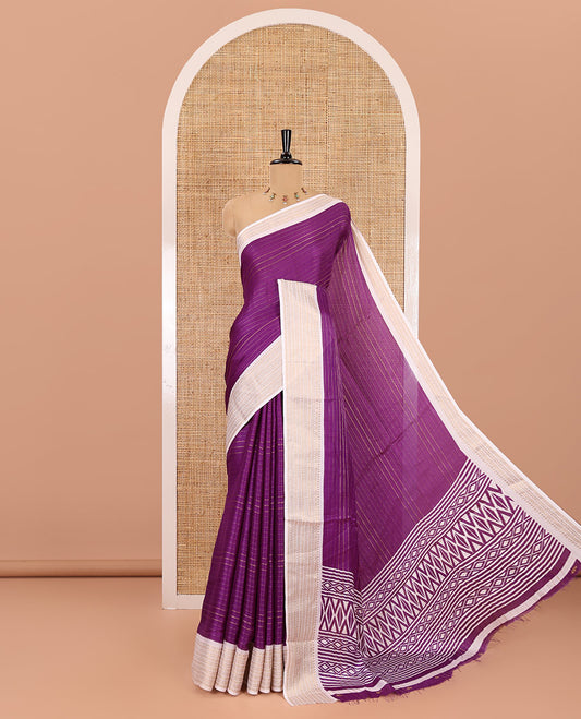 Dark violet horizontal striped moss chiffon saree, contrast traditional zari border, geometric patterns printed pallu, and a printed blouse