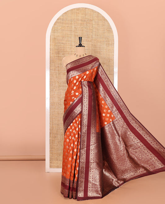 Rust orange zari buttas kanchi silk saree, contrast traditional rettai pettu border of peacock chakram, intricate pallu, and a zari design pallu