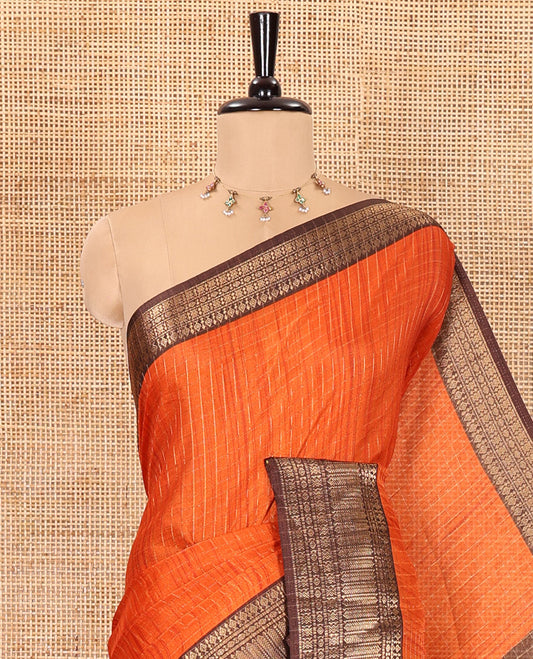 Rust orange zari checked dola silk saree, contrast traditional zari border, kalamkari floral-peacock printed pallu, and a kalamkari printed blouse