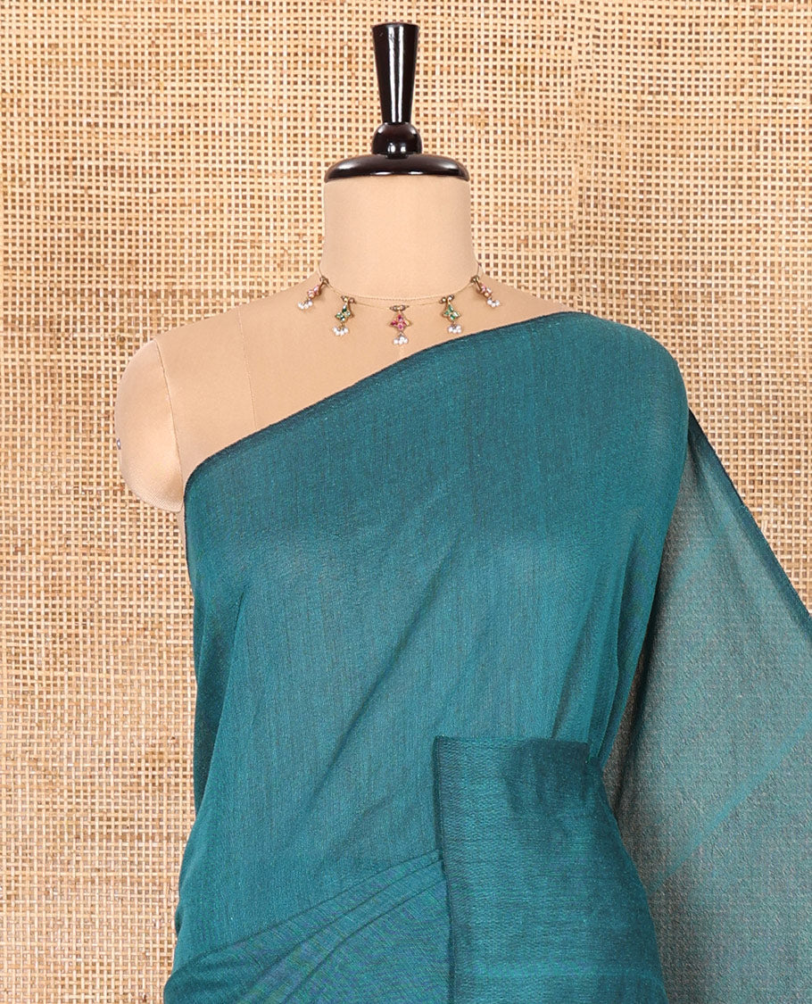 Borderless Rama Color Plain Khadi Mul Cotton Saree Features a Self-Pallu with Tassels, and a Matching Blouse