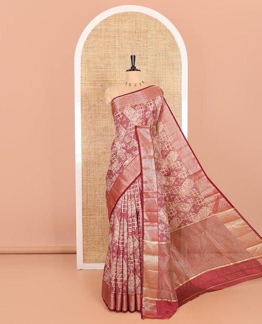 Maroon Semi-Tussar Saree Meticulously Crafted with Floral-Enclosed Diamond Patterns Printed Across the Body, Featuring a Subtly Woven Border with Traditional Zari Designs, and a Pallu Elevated with Zari Stripes, Paired with a Matching Blouse
