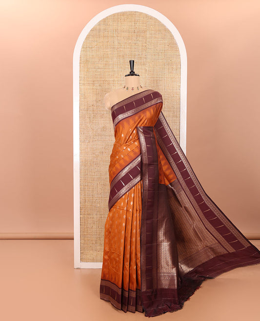 Rust Orange Soft Silk Saree Embellished with Diamond Buttas Woven All Over Its Body, Highlighted with a Contrast Traditional Zari Design Temple Border, Meticulously Woven Pallu of Intricate Designs, and Paired with a Contrast Zari Design Blouse