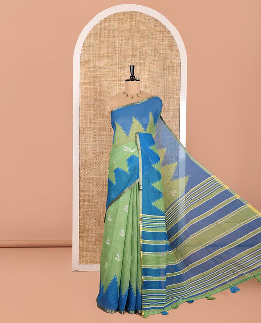Green Linen Cotton Saree Decorated with Batik-Style Buttas Printed All Over Its Body, Complemented by a Contrast Temple Zari Piping Border, Striped Pallu, and Paired with a Matching Striped Blouse