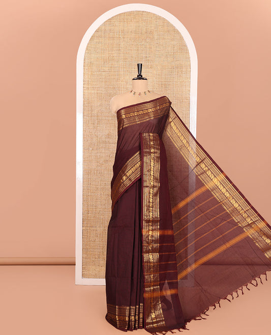 Coffee Brown Plain Chettinad Cotton Saree, Highlighted by a Temple Traditional Zari Border of Peacock Designs, Striped Pallu, and Paired with a Matching Blouse