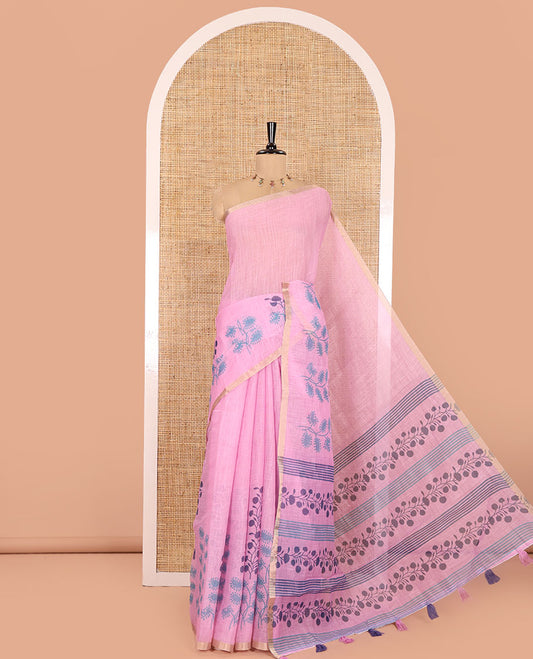 Pink Linen Saree, Adorned with Floral Motifs Printed on Its Body, a Subtle Piping Border, Pallu Steeped with Floral Motifs and Stripes, and Paired with a Contrast Blouse