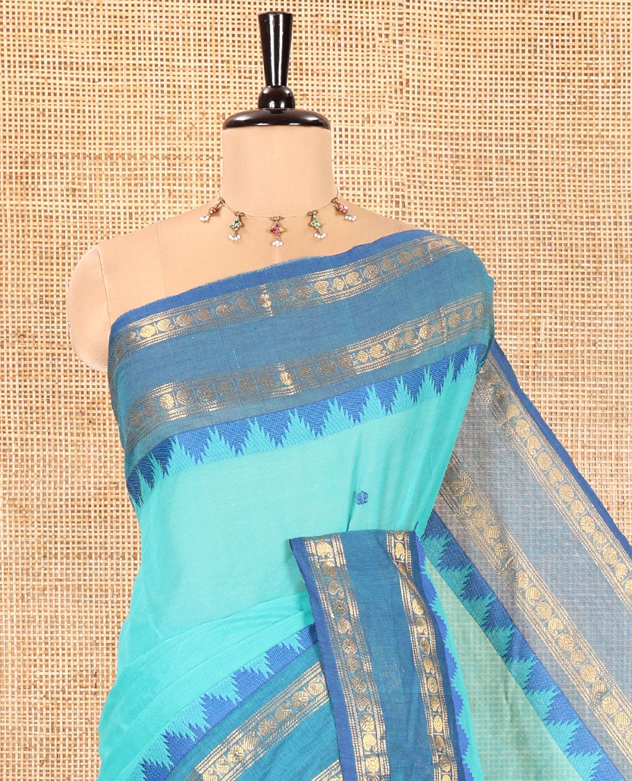 Rama Chettinad Cotton Saree, Subtly Decked up with Thread Buttas All Over Its Body, Complemented by a Contrast Temple Rettai Pettu Traditional Zari Design Border, Pallu of Stripes and Buttas, and Paired with a Matching Blouse