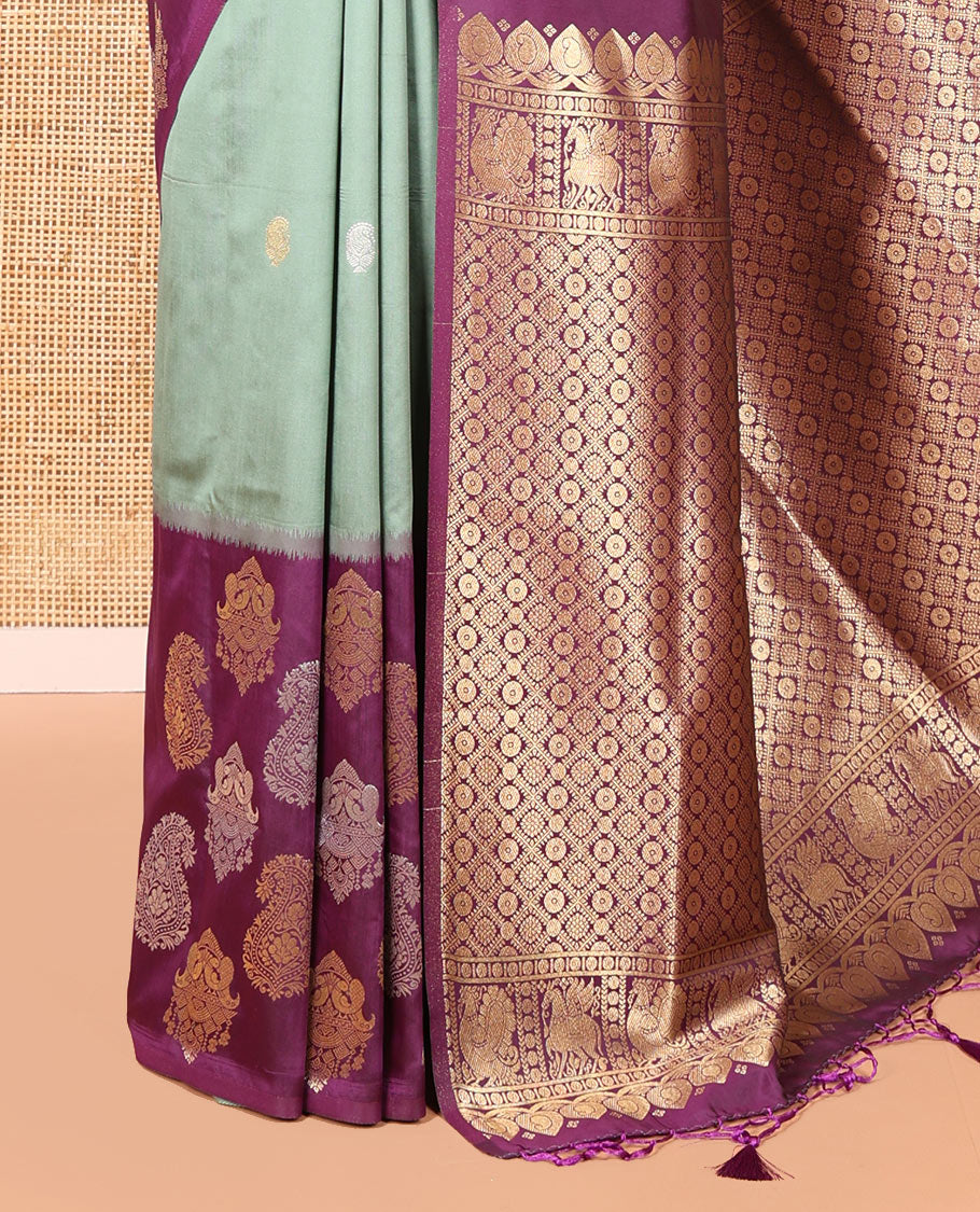 Green Elite Soft Silk Saree, Elevated with Zari Buttas All Over Its Body, Complemented by Contrast Border Steeped with Zari Buttas, Grand Jaal Design Pallu, and Paired with a Contrast Blouse