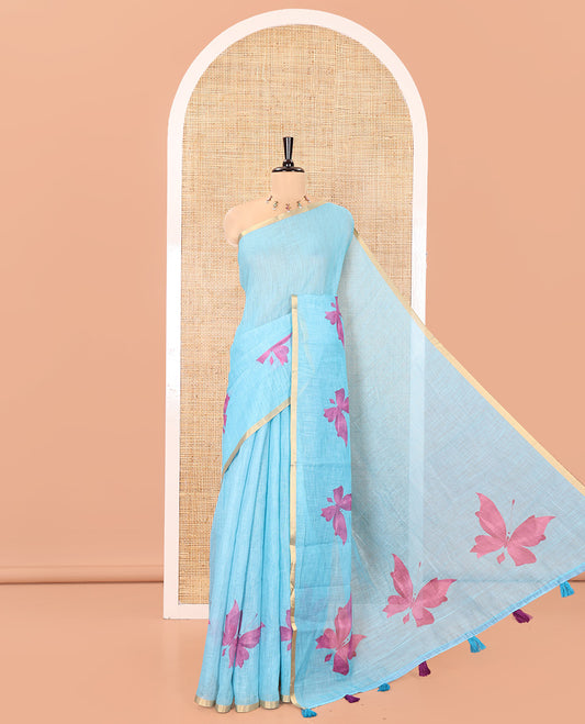 Blue Linen Cotton Saree, Mesmerized with Butterfly Buttas All Over Its Body, Subtle Piping Border, Pallu of Butterfly Print, and Paired with a Contrast Fairy Motifs Printed Blouse