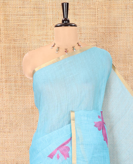 Blue Linen Cotton Saree, Mesmerized with Butterfly Buttas All Over Its Body, Subtle Piping Border, Pallu of Butterfly Print, and Paired with a Contrast Fairy Motifs Printed Blouse