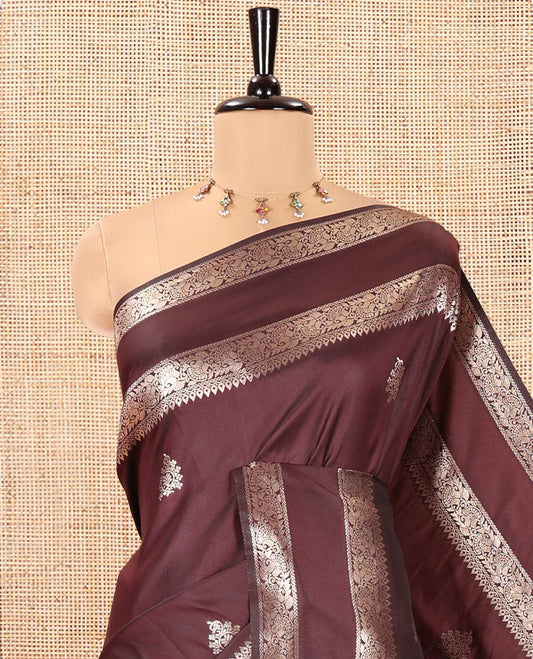 Brown Kanchi Soft Silk Saree, Enriched with Zari Buttas All Over Its Body, Highlighted by Traditional Zari Rettai Pettu Border, Intricately Designed Pallu, and Paired with a Matching Blouse