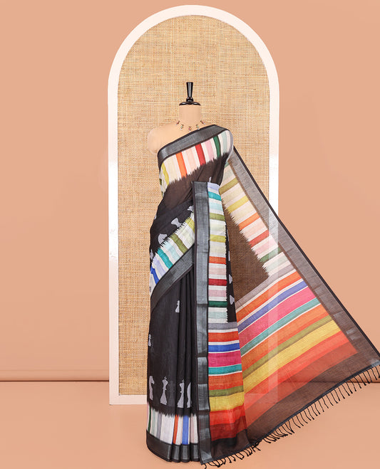 Black Linen Cotton Saree, Creatively Printed with Chess Coins All Over Its Body, Complemented by a Contrast Multi-Color Striped Zari Border, Rainbow-Colored Striped Pallu, and Paired with a Contrast Blouse