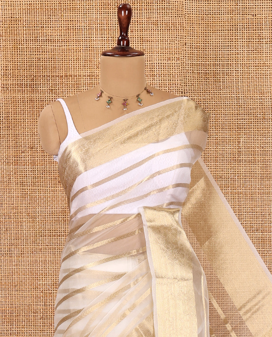 Cream Semi-Organza Saree, Boldly Accentuated with Zari Stripes, Highlighted by a Zari Traditional Border, and a Matching Blouse