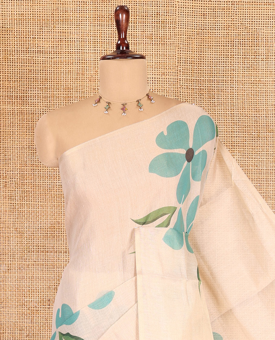 Borderless Cream-Sea Green Tissue Saree Features Floral Print, a Floral Printed Pallu, and a Contrast Blouse
