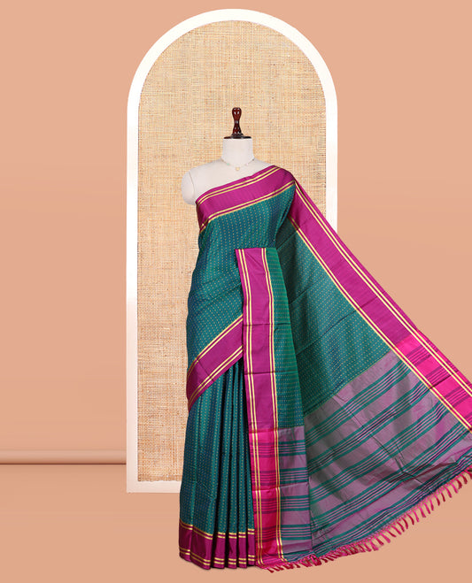 Peacock Green Semi-Soft Silk Saree Steeped with Plus-Shaped Buttas, Contrast Border, and a Matching Blouse