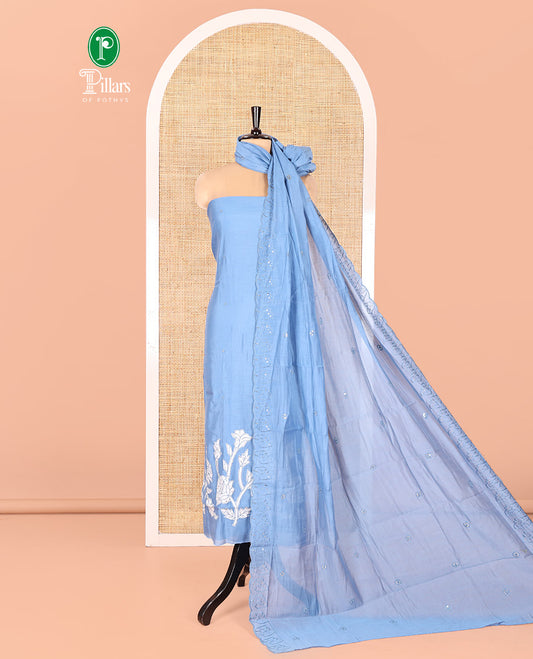 Blue Mul Chanderi Material Chudidar Set, Adorned with Appliqué Floral Embroidery on Its Top, a Plain Santoon Bottom, and Paired Scallop Embroidered Mul Chanderi Dupatta
