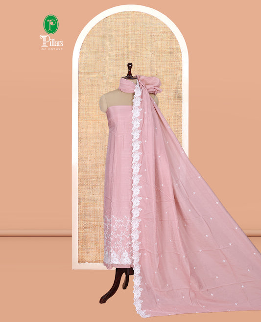 Peach Mul Chanderi Material Churidar with Delicate Floral Embroidered Top, a Plain Bottom, and Scallop Embroidered Dupatta