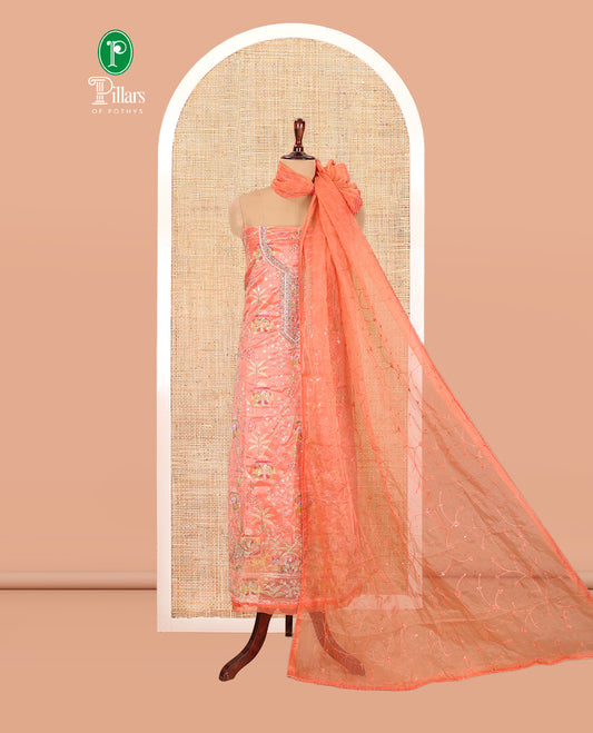 Fanta Orange Organza Material Churidar, Intricately Printed Outlined Embroidery Top, a Matching Bottom, and a Floral Embroidered Dupatta