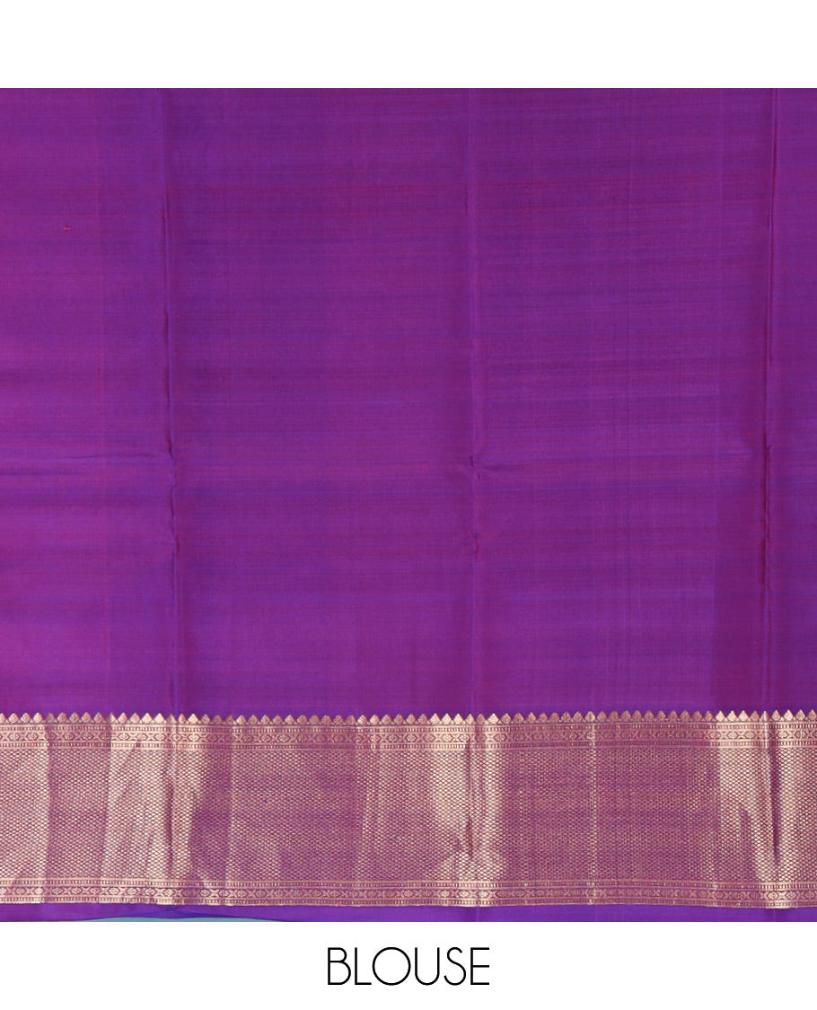 Violet Vasundhara Silk Saree Gracefully Embellished with Zari Buttas, Highlighted by a Zari Border Featuring Thilakam Mokku, Muthu, Cross Kamalam, and Mayil Kann Designs, Elegantly Embellished Pallu, and Paired with a Matching Blouse