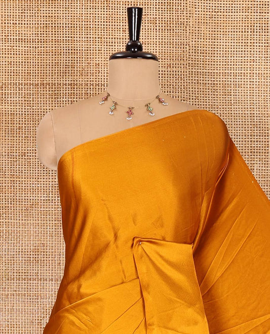 Chikku-mustard half-and-half plain and kalamkari floral printed satin crepe saree, plain border, pallu of floral vine and peacock printed, and kalamkari floral printed blouse