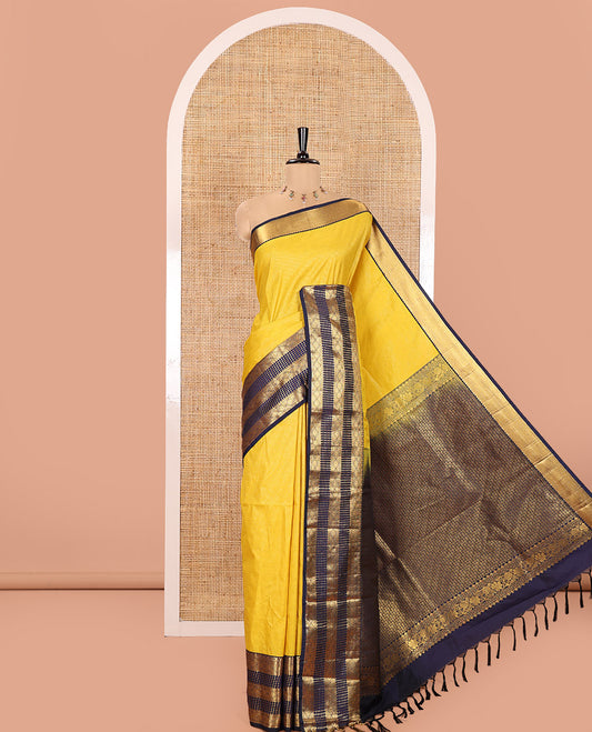 Yellow Kanchipuram Budget Silk Saree, Subtly Sparkled with Geometric Jacquard All Over Its Body, Complemented by a Contrast Traditional Zari Border of Diamond Designs, Grand Jaal Pallu, and Paired with a Contrast Blouse