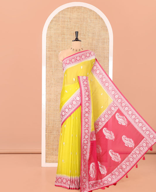 Green Banaras Fancy Georgette Saree, Decorated with Zari Buttas All Over Its Body, Complemented by a Contrast Floral Creeper Zari Border, Pallu Features Paisley Designs, and Paired with a Contrast Blouse