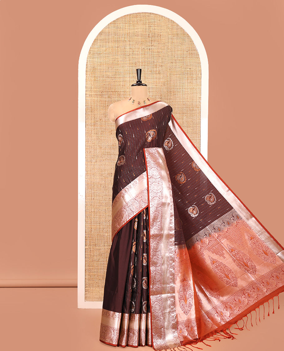 Coffee Brown Semi-Soft Silk Saree, Meticulously Crafted with Vaira Oosi, and Paisley Buttas All Over Its Body, Complemented by Contrast Traditional Border of Paisleys, Intricately Designed Pallu, and Paired with a Contrast Blouse