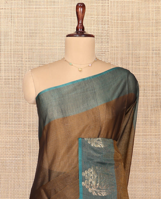 Brown Silk Cotton Saree, Decorated with Buttas All Over Its Body, Complemented by Contrast Border of Parrot Chariot Designs, Temple Pallu, and Paired with a Contrast Blouse