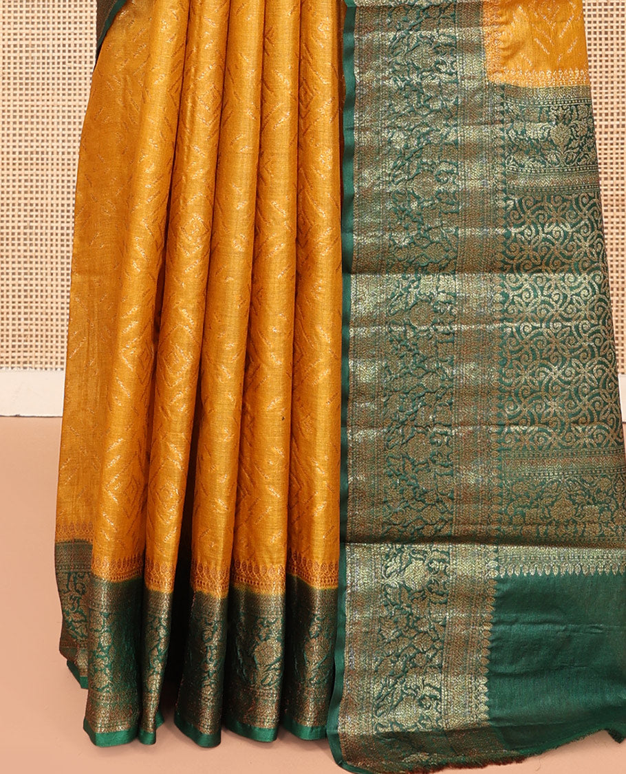 Mustard Tussar Silk Saree Features Zari Designs, Complemented by a Contrast Floral Zari Border, Intricately Designed Pallu, and a Contrast Blouse