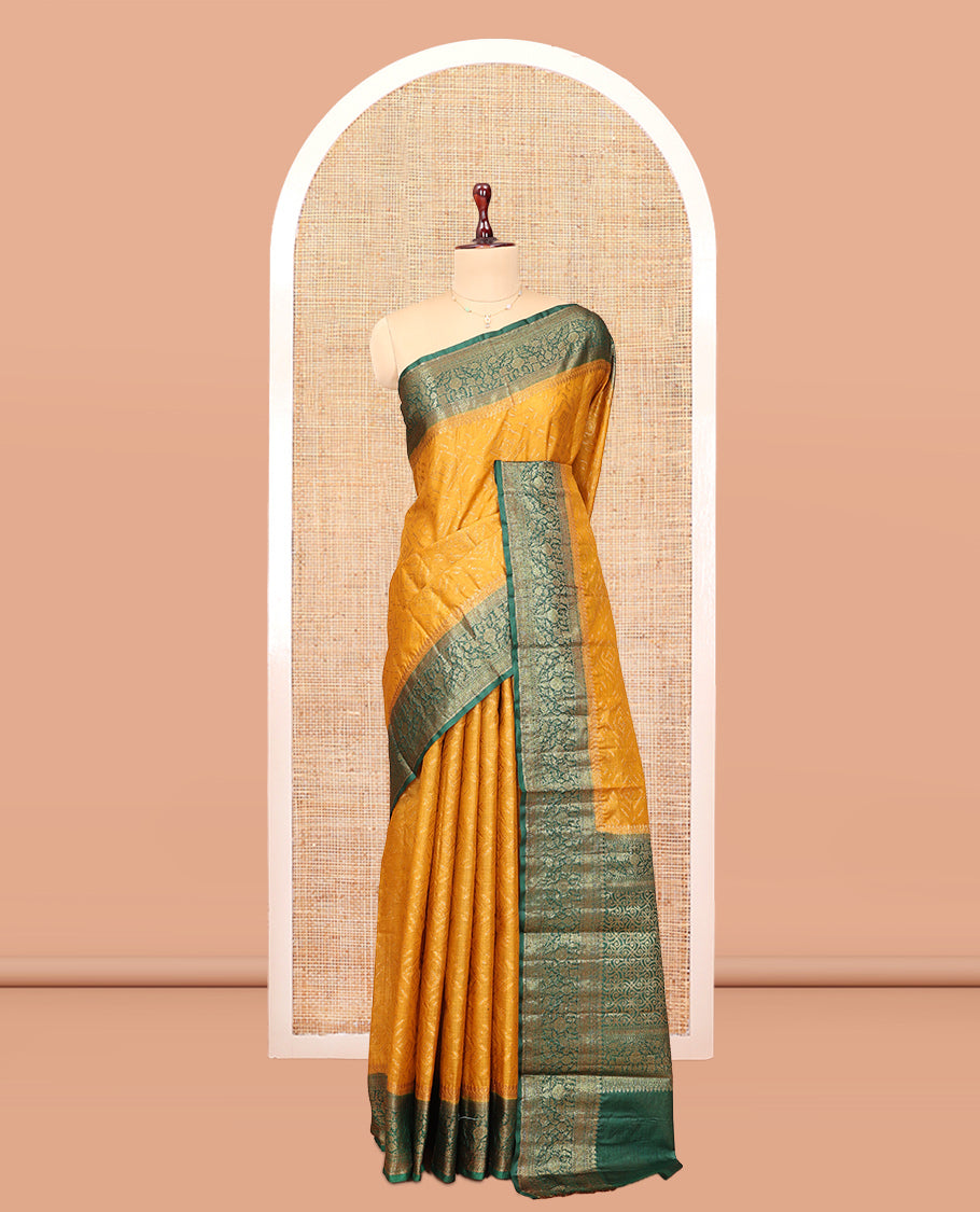 Mustard Tussar Silk Saree Features Zari Designs, Complemented by a Contrast Floral Zari Border, Intricately Designed Pallu, and a Contrast Blouse