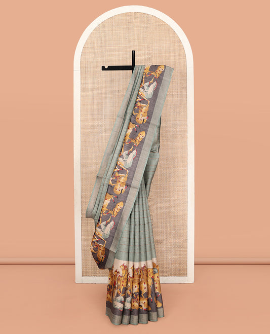 Green Tussar Silk Saree, Subtly Sparkled with Stripes, Complemented by a Contrast Pichwai Cow Border, Printed Pallu, and a Matching Blouse