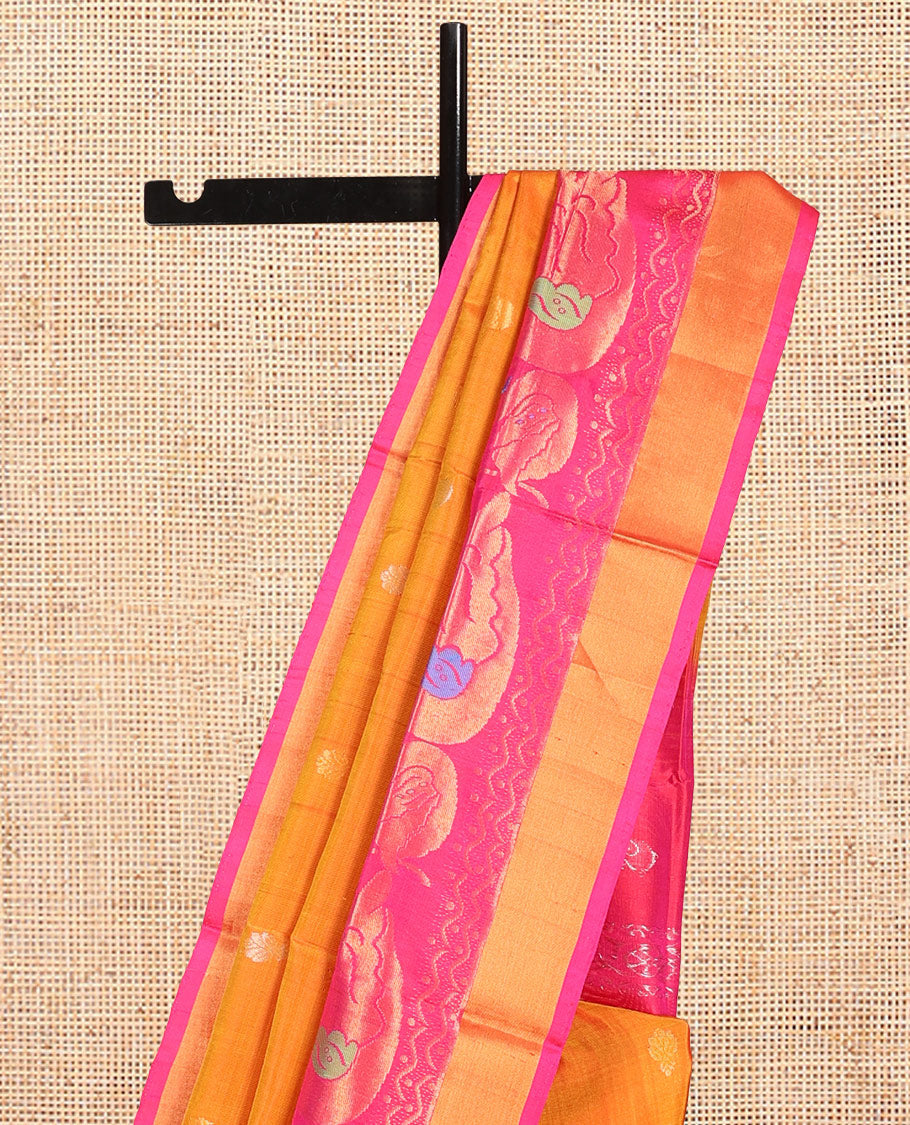 Orange Uppada Silk Saree, Masterfully Woven with Zari Buttas, Complemented by Contrast Peacock Buttas Border, Grand Jaal Pallu and a Contrast Blouse