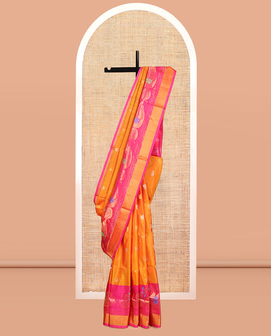 Orange Uppada Silk Saree, Masterfully Woven with Zari Buttas, Complemented by Contrast Peacock Buttas Border, Grand Jaal Pallu and a Contrast Blouse